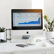Photo of a computer showing with a graph on the screen
