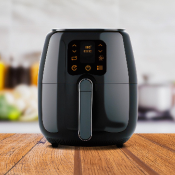 Photo of a black air fryer in on a kitchen worktop