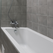 Bath tub in grey bathroom