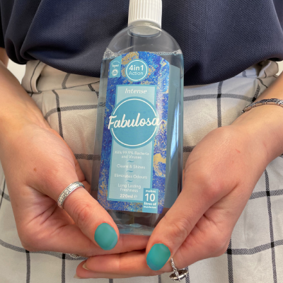 Photo of a person holding a bottle of Fabulosa