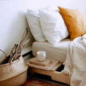 Photo of a boho bedroom and a bed with comfy pillows