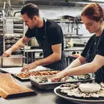 Chefs cooking in a professional kitchen